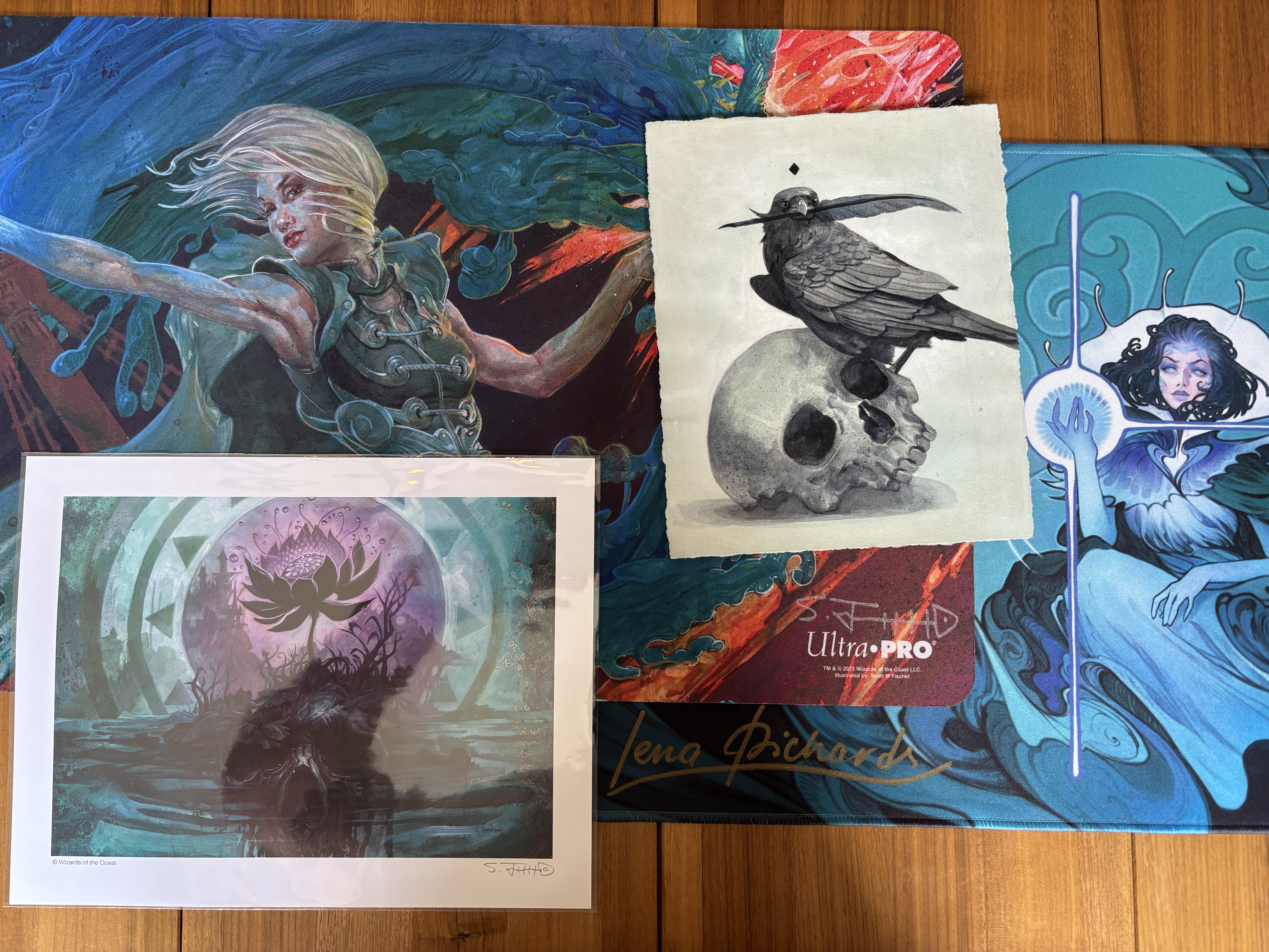 My 2025 Gen Con art show haul, arrayed on my dining room table