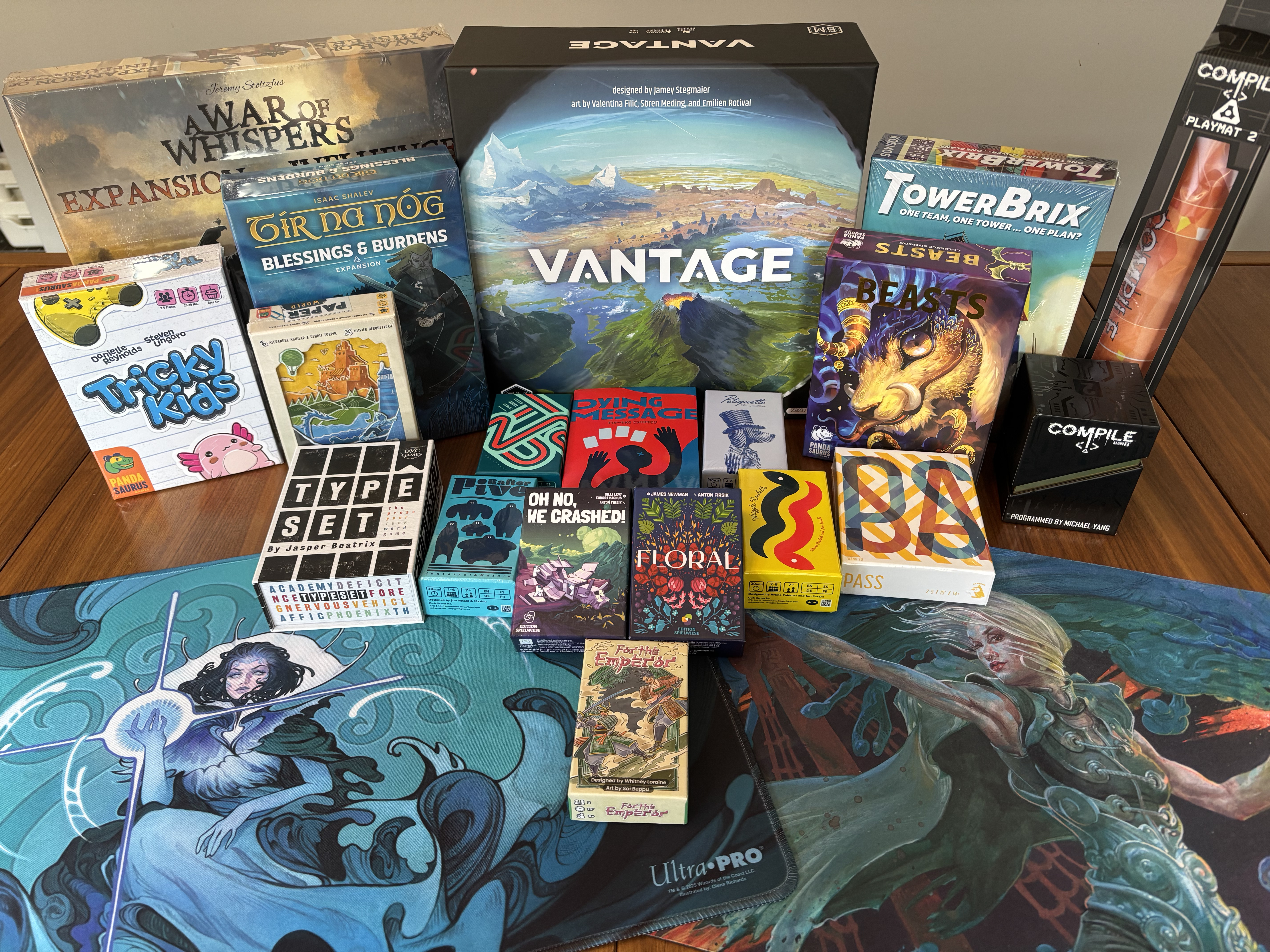 My 2025 Gen Con haul, arrayed on my dining room table